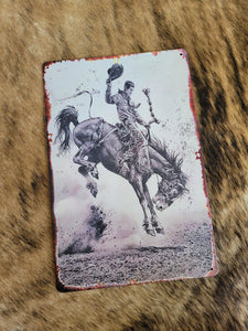 Saddle bronc metal sign