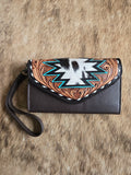 Tooled leather wristlet wallet