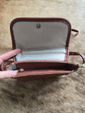 Tooled zippered crossbody purse