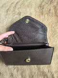 Tooled leather wristlet wallet